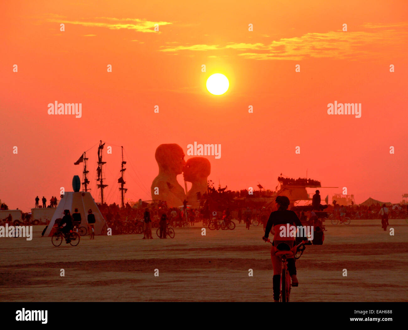 Sunrise on the playa at the annual Burning Man festival in the desert August 29, 2014 in Black Rock City, Nevada. Stock Photo