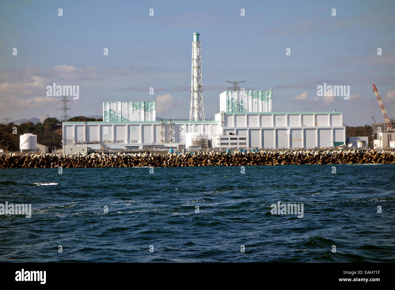 View from the water of the contaminated Fukushima Daiichi Nuclear Power Station November 6, 2014 in Okuma, Japan. The plant suffered a catastrophic meltdown of three of the plant's six nuclear reactors in March 2011. Stock Photo