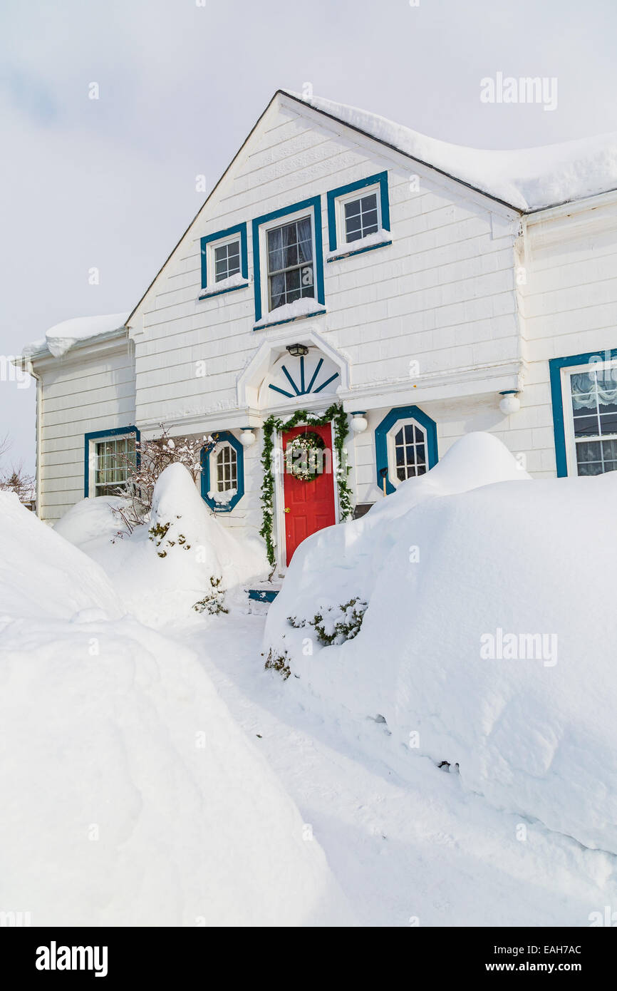 Old style north American family home after the snow storm Stock Photo