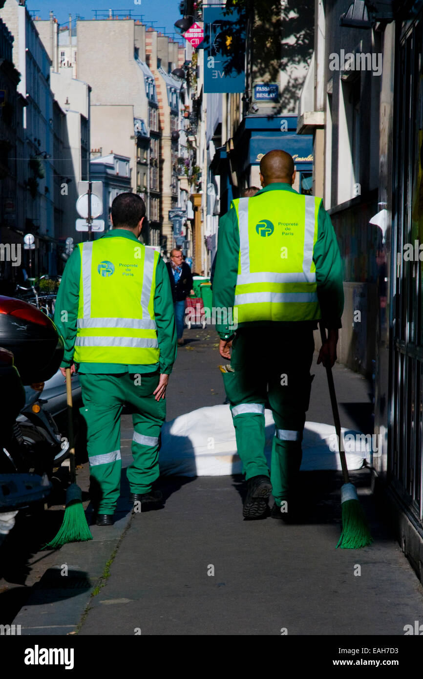 two-parisian-street-cleaners-go-about-their-business-stock-photo-alamy