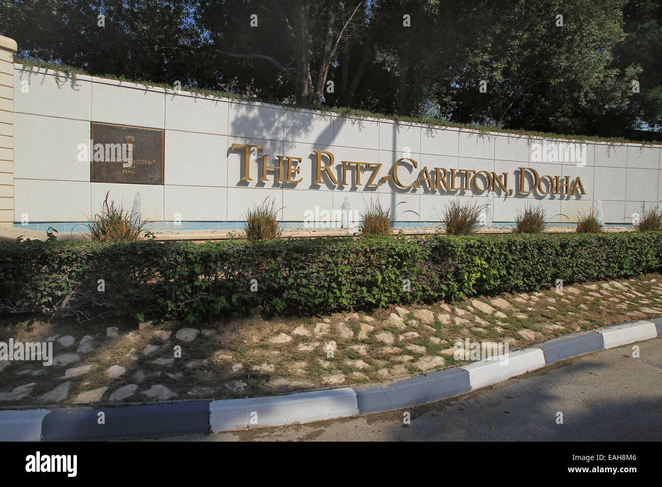 A general view showing the name of the Ritz-Carlton Hotel, Doha, Qatar from the bottom of the driveway Stock Photo
