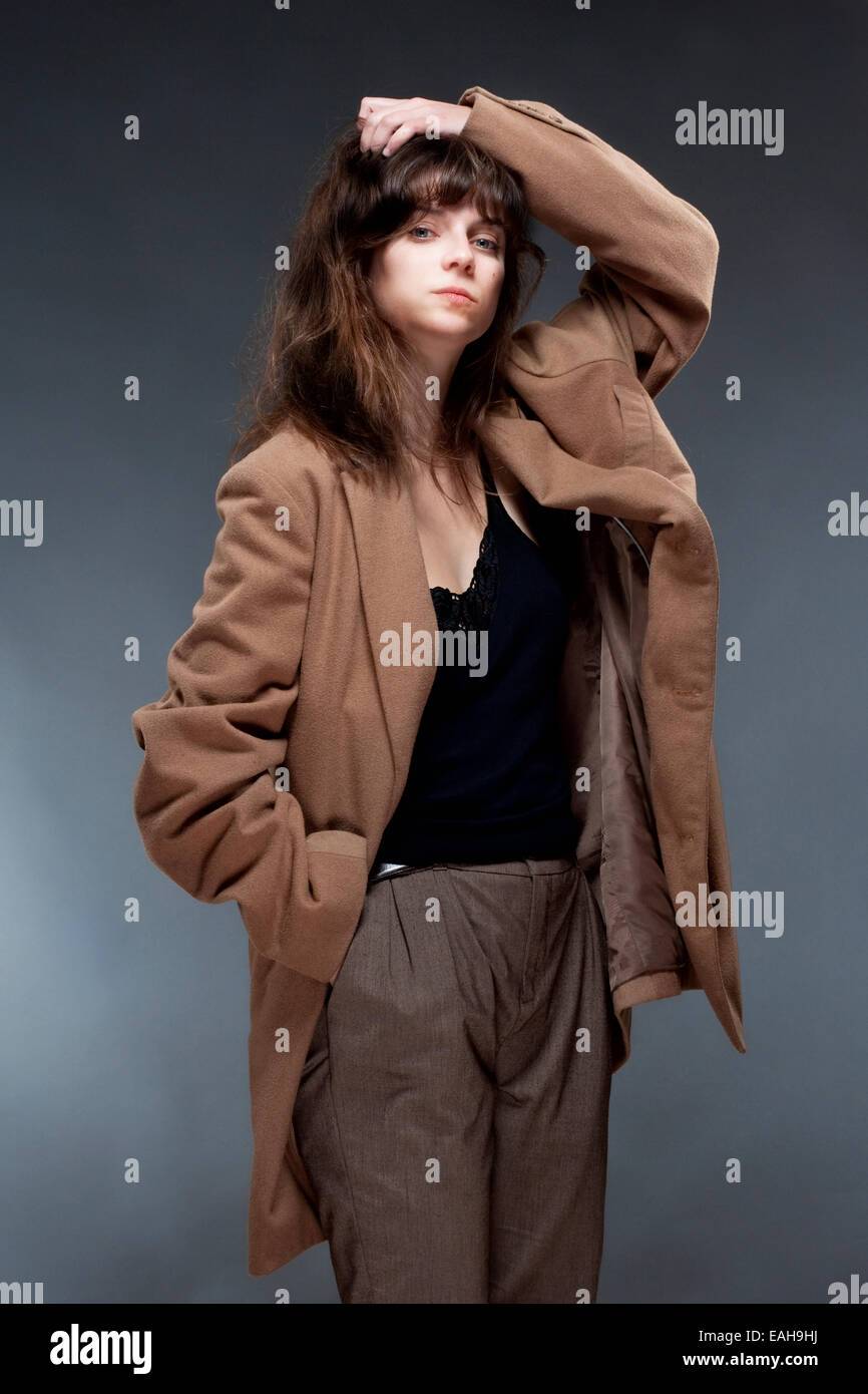 Portrait of a Young Woman in Brown Coat Stock Photo