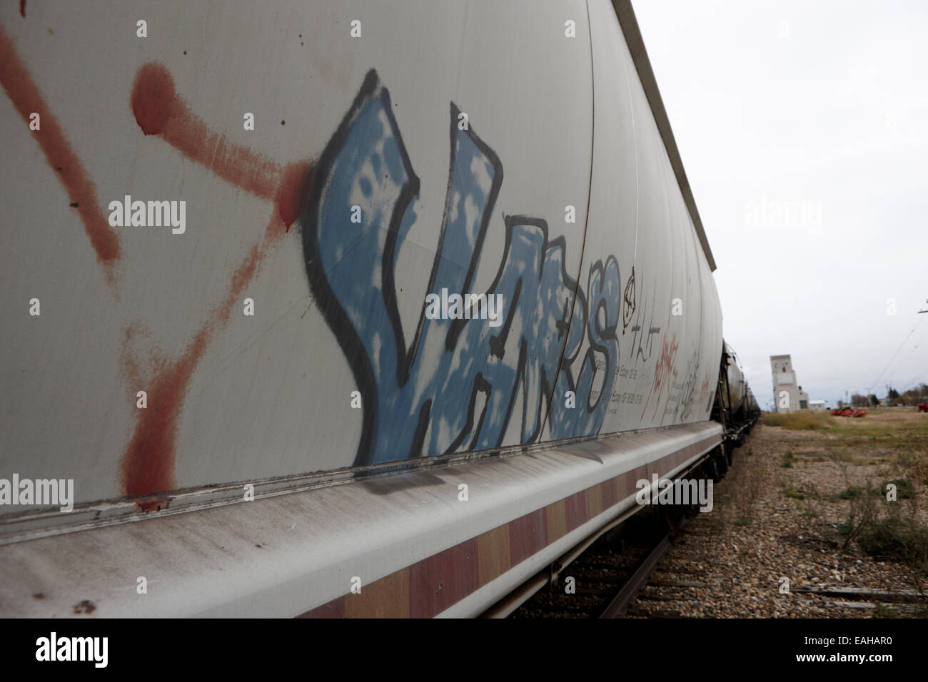 graffiti on freight grain trucks on canadian pacific railway through assiniboia Saskatchewan Canada Stock Photo