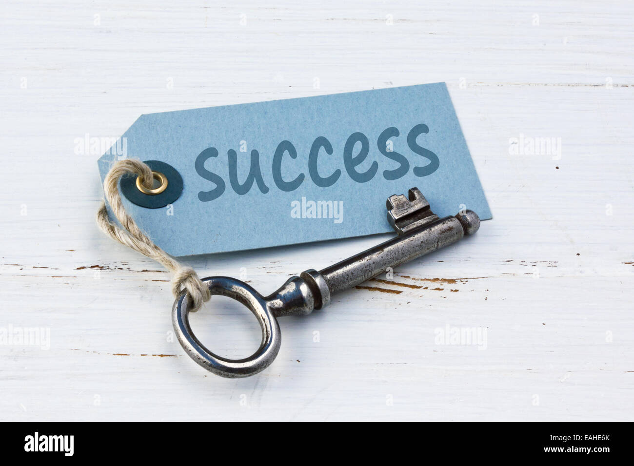 Old key and card with lettering  success Stock Photo