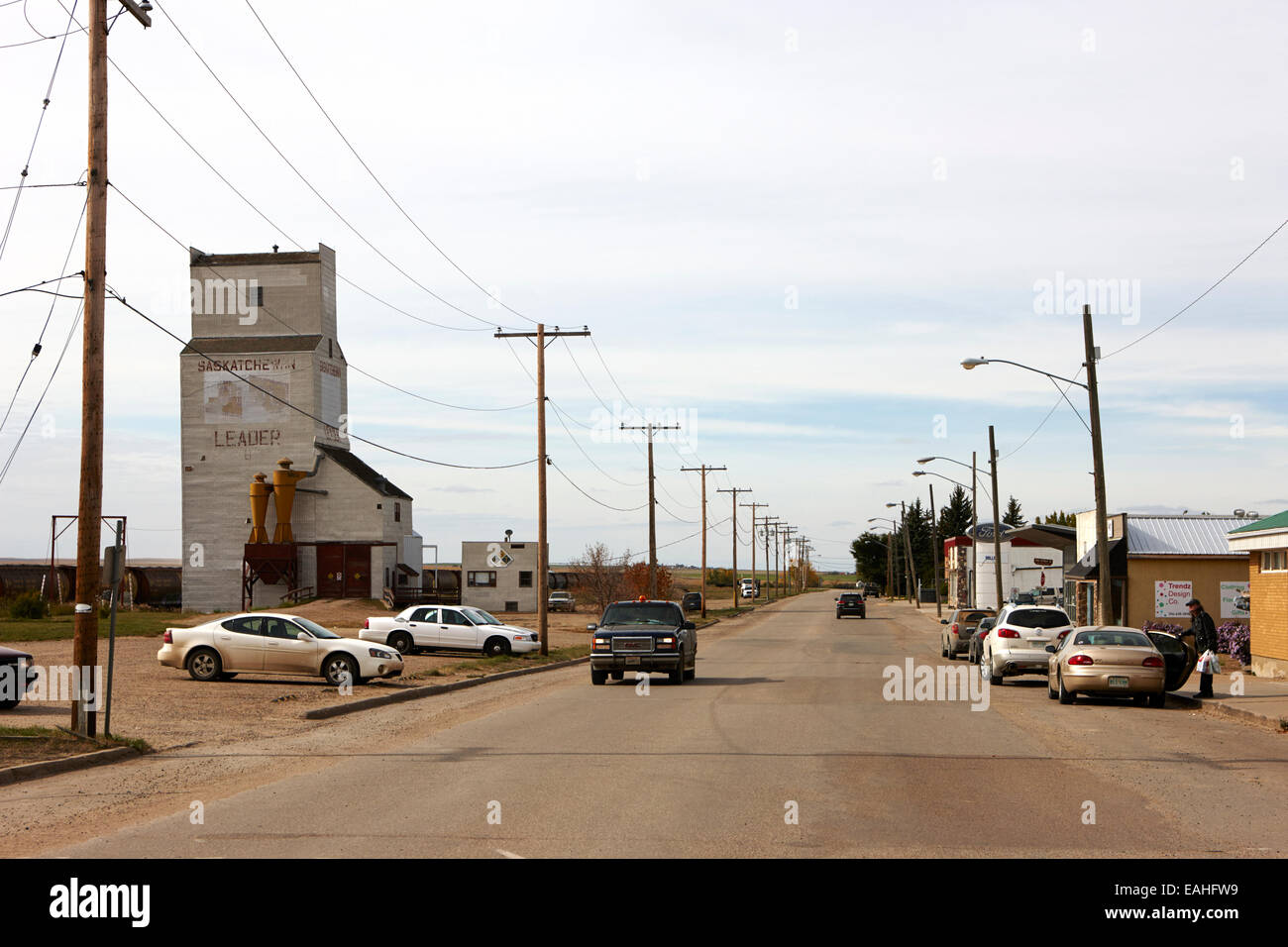 grain elevator and stores on first avenue the town of leader sk Canada Stock Photo