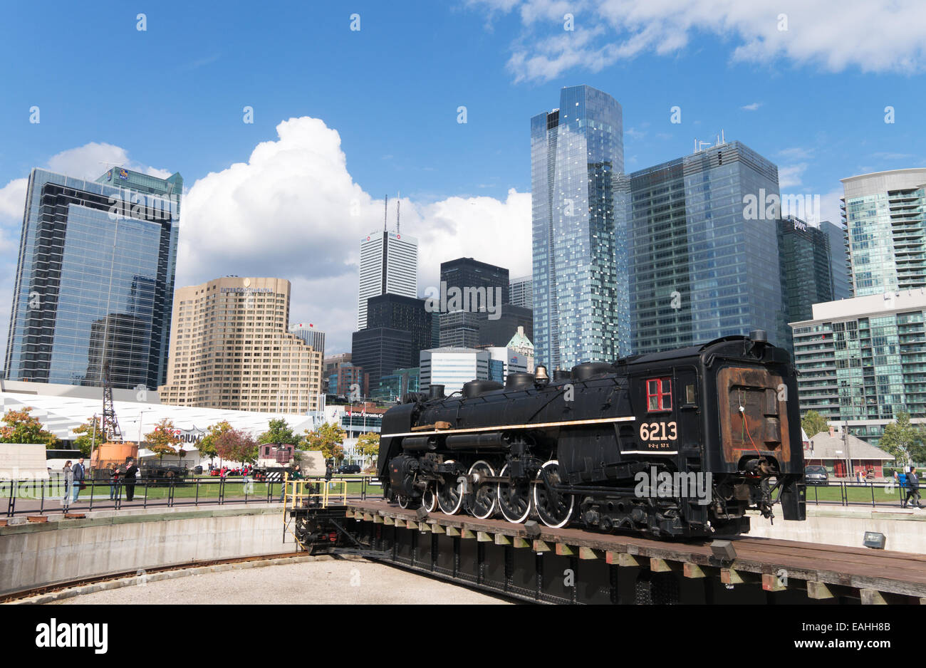 Steam train 6213 on turntable at John Street Roundhouse  with modern buildings in background Toronto, Ontario, Canada Stock Photo