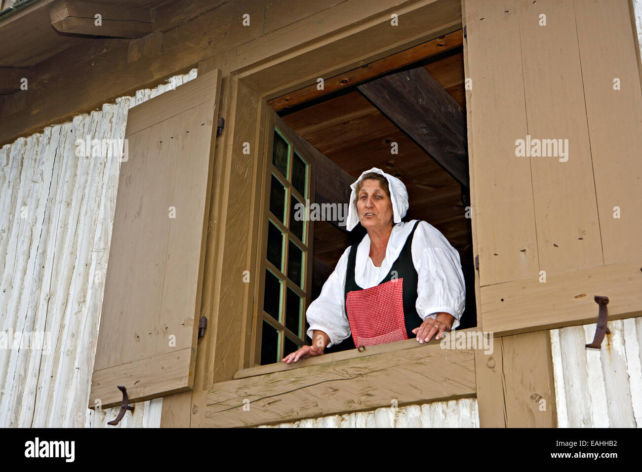 A woman banters during a public punishment of a fisherman for stealing a bottle of wine at the Fortress of Louisbourg, Louisbour Stock Photo