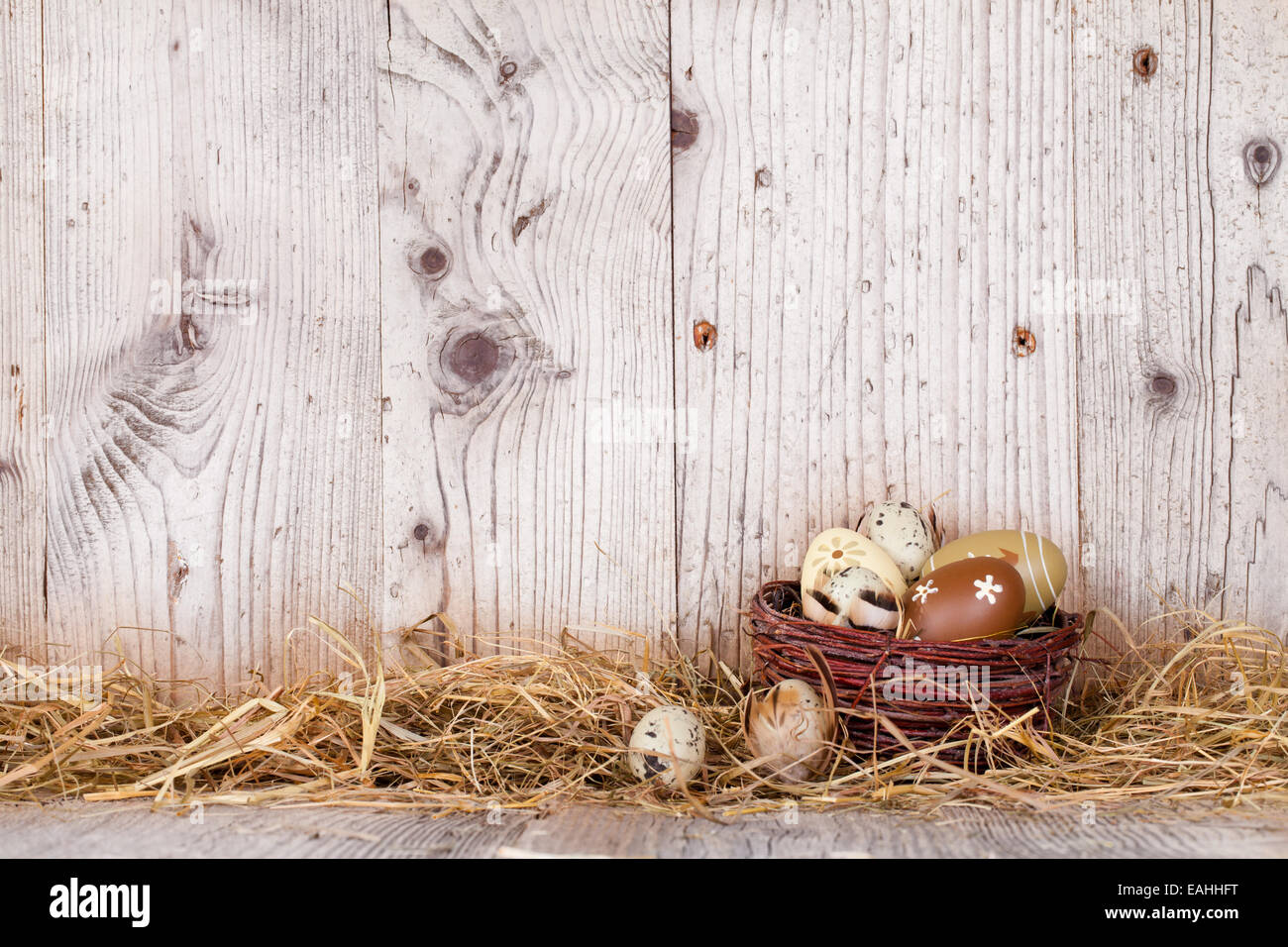 Easter still life with traditional decorative eggs in straw Stock Photo
