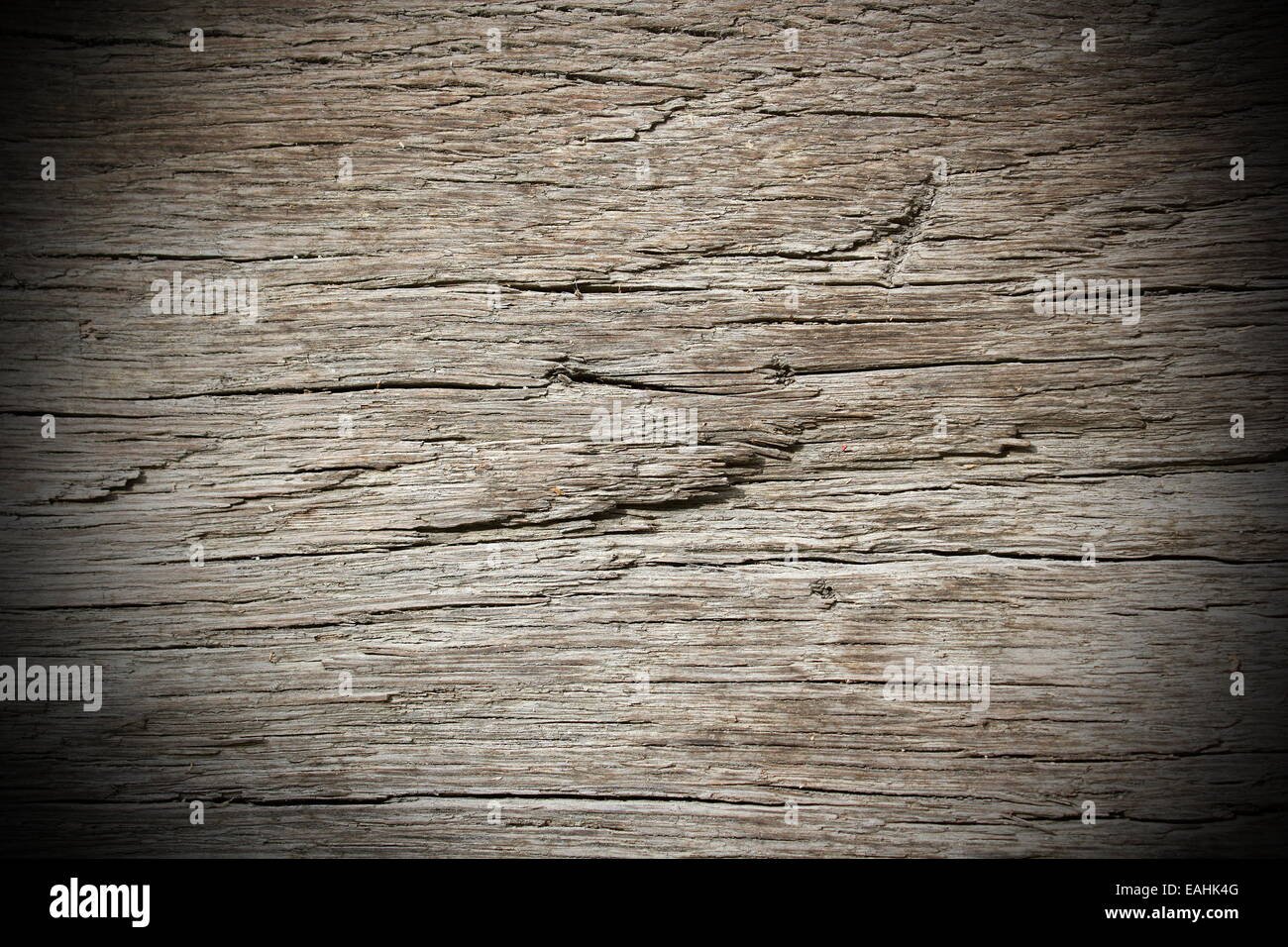 detail on ancient oak wooden beam with vignette Stock Photo