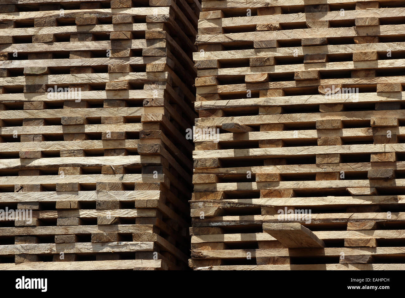 Stacked cut boards drying in the sun in a sawmill in Cotacachi, Ecuador
