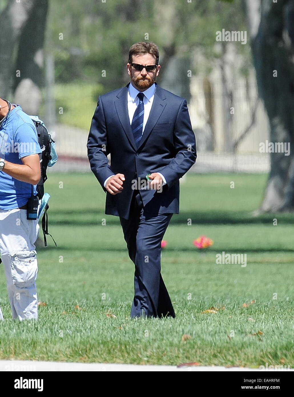 Actor Bradley Cooper puts on a suit for a funeral scene for his