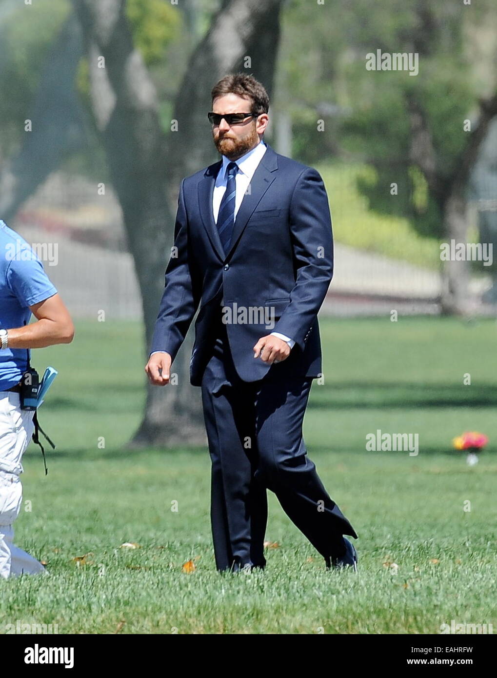 Actor Bradley Cooper puts on a suit for a funeral scene for his