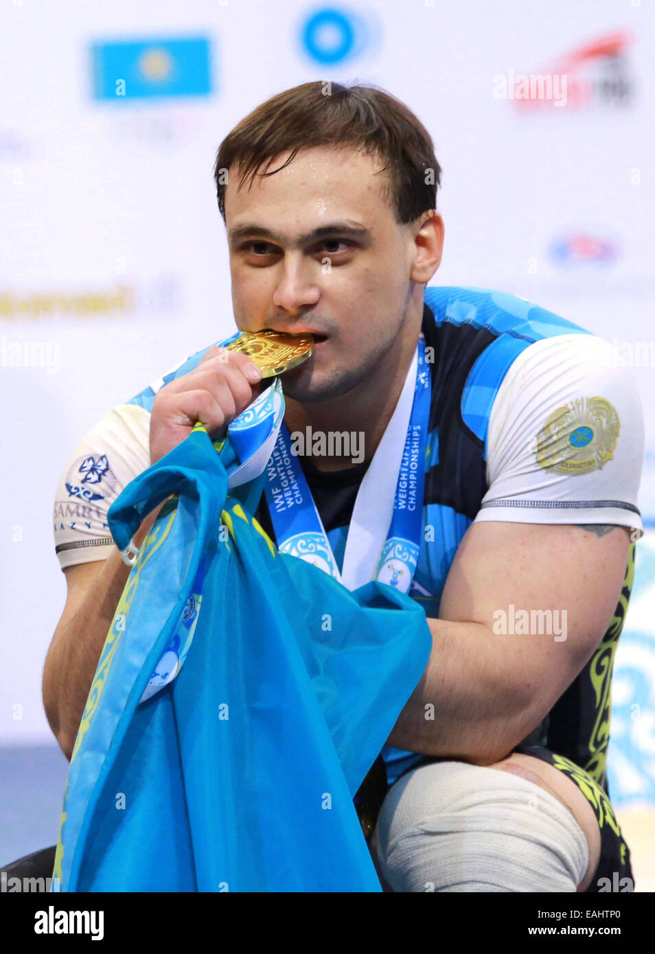 Almaty. 16th Nov, 2014. Kazakhstan's Ilya Ilyin poses with his gold ...