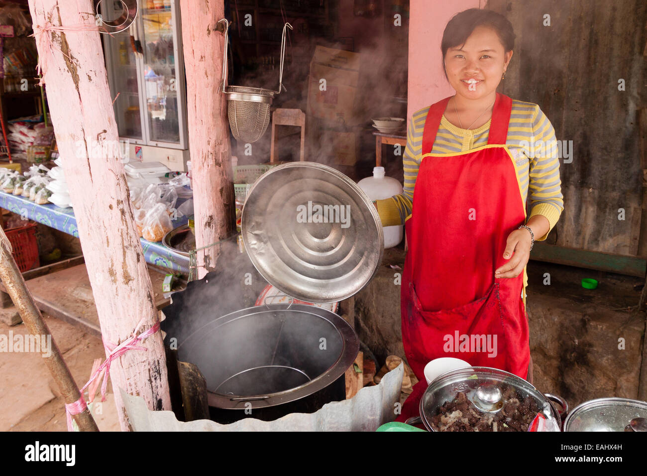 A Lao woman cooking street food Stock Photo