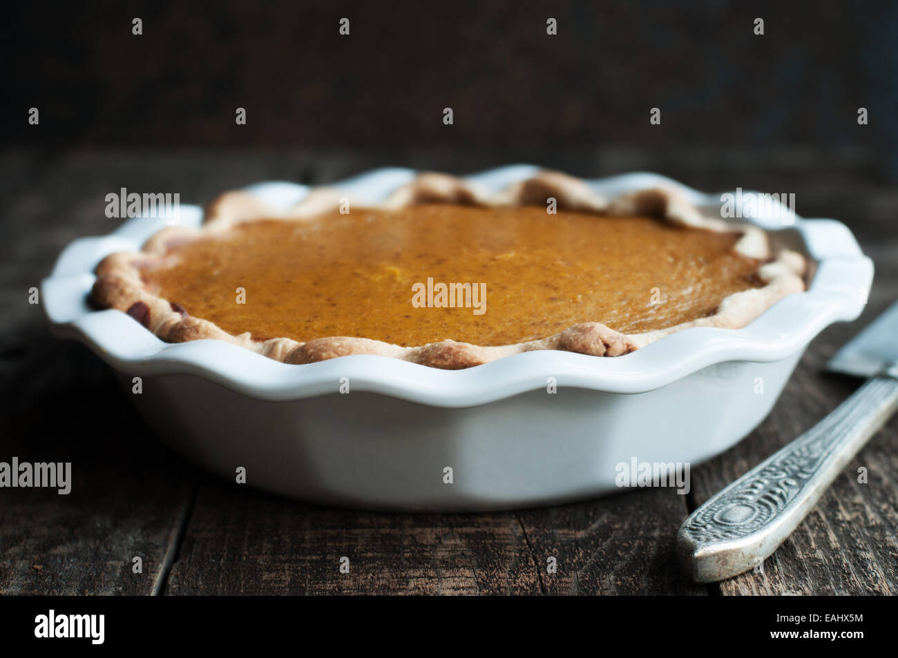 Fresh Fall pumpkin pie in a white dish Stock Photo