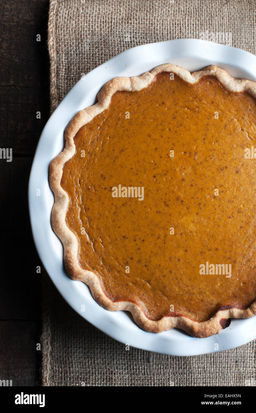 Fresh Fall pumpkin pie in a white dish Stock Photo