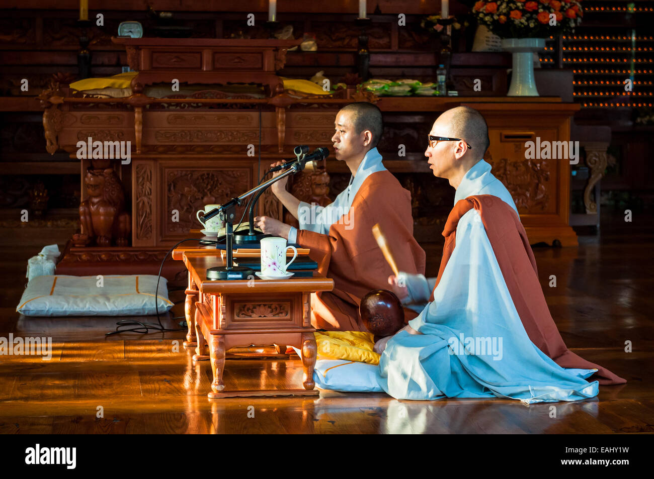 Two Buddhist monks chant prayers at Bongeunsa Temple on October 12