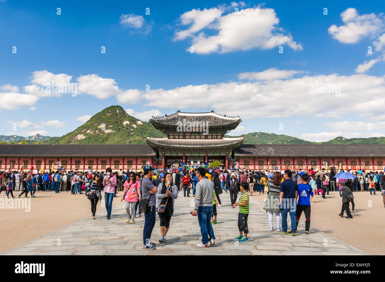 Hundreds of tourists gather outside of Gyeongbokgung Palace on October 4, 2014 in Seoul, South Korea. Stock Photo