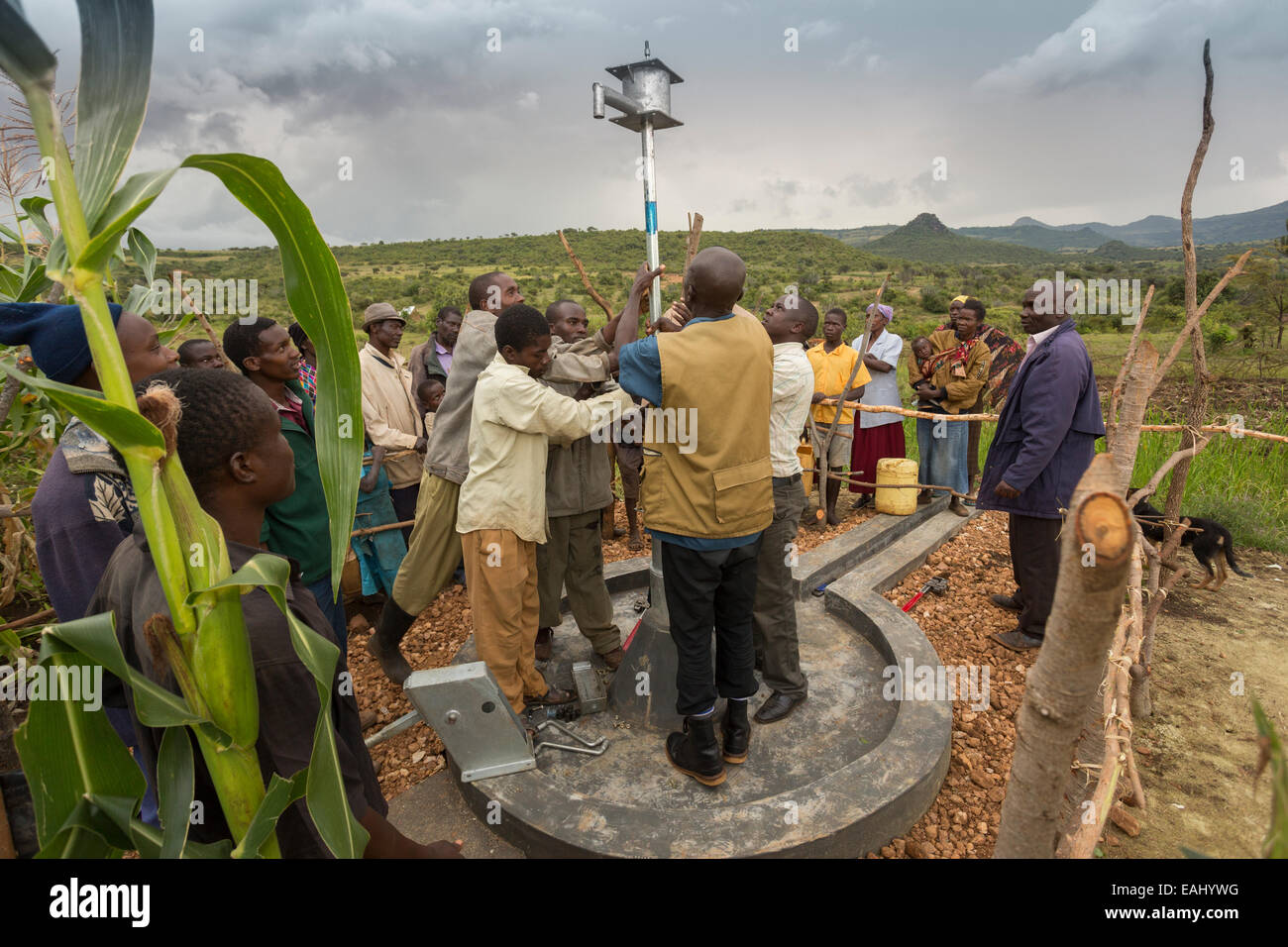Community members in Sukuroi village, Bukwo District, Uganda work to construct a shallow well in their community. Stock Photo