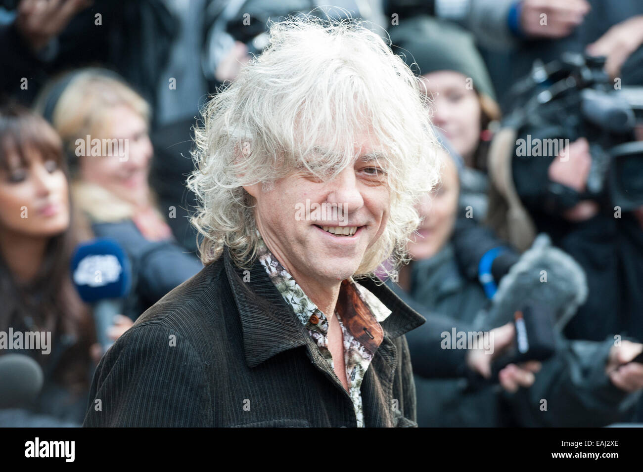 Basing Street, London, UK. 15th November 2014. Artists arrive at Sarm Studios in Notting Hill, west London, to record Band Aid. Pictured: Bob Geldof greets the crowd outside Sarm Studios. Credit:  Lee Thomas/Alamy Live News Stock Photo