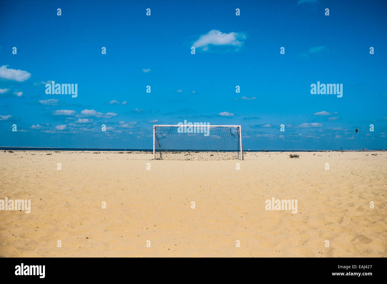 Stock photo- Qatar 2022 gets ready for the world cup with goal posts on a beach in the middle east Stock Photo