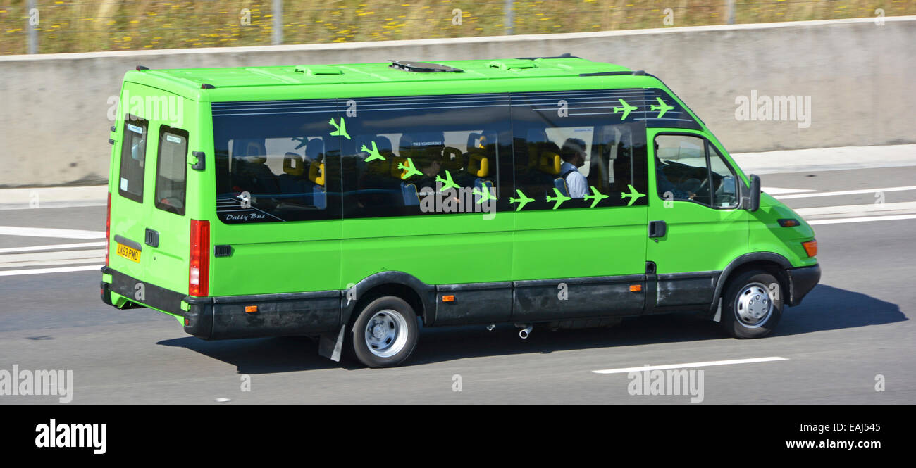 Green mini bus with aircraft graphics possibly transporting passengers to  airport Stock Photo