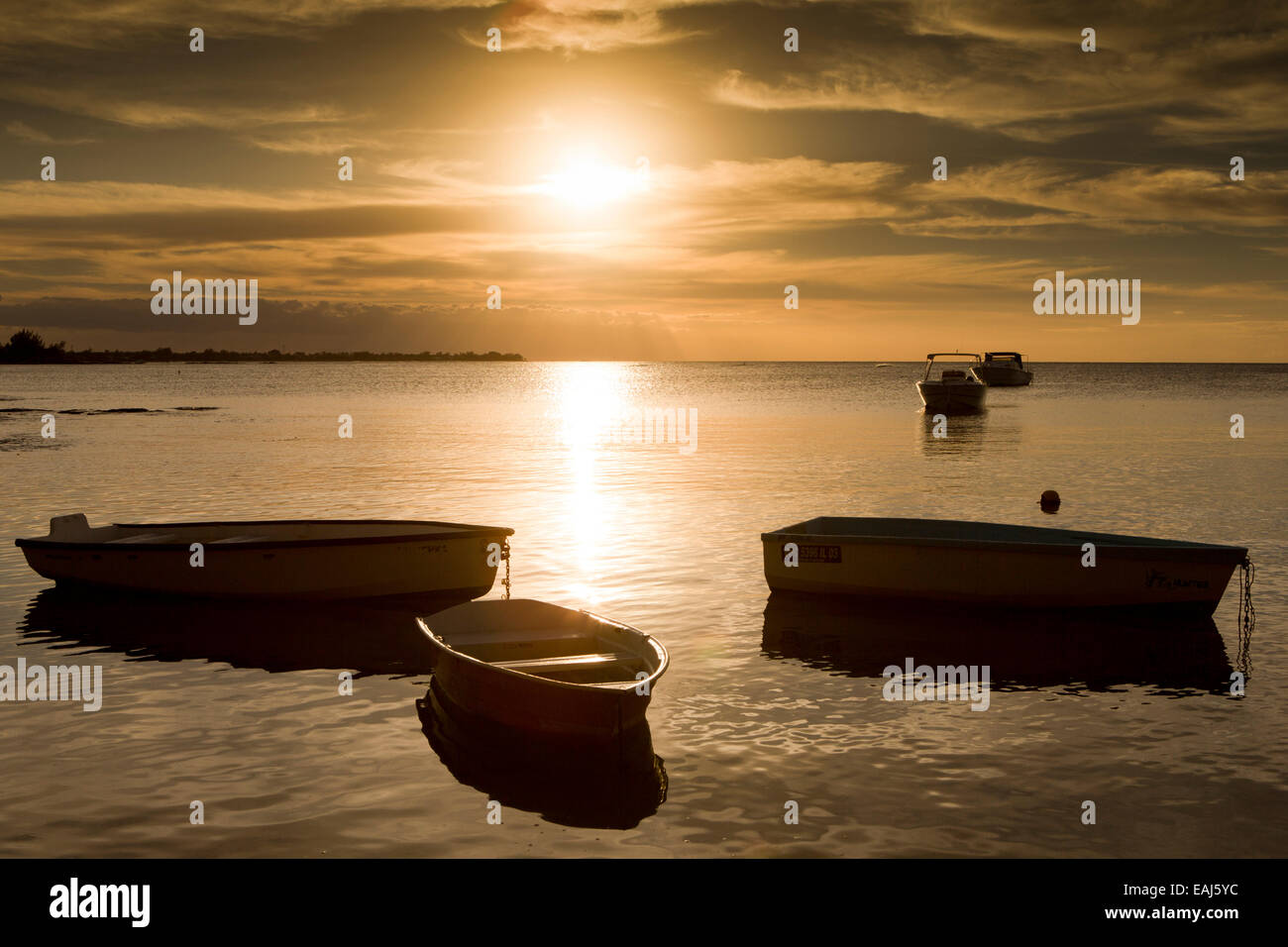 Mauritius, Pereybere, leisure boats lit by setting sun, on northern coast Stock Photo