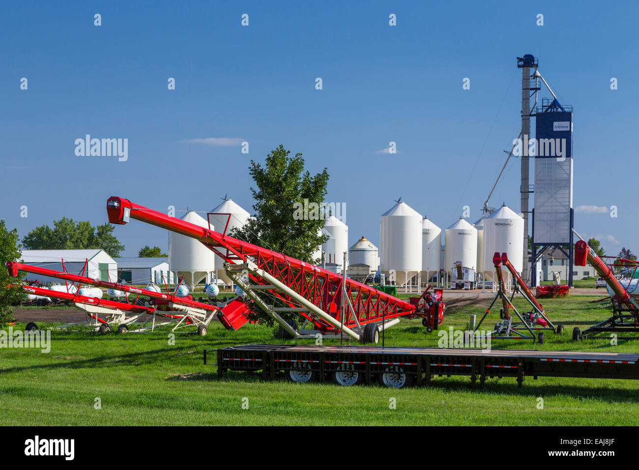 Farm implements and grain bins at Washburn, North Dakota, USA Stock