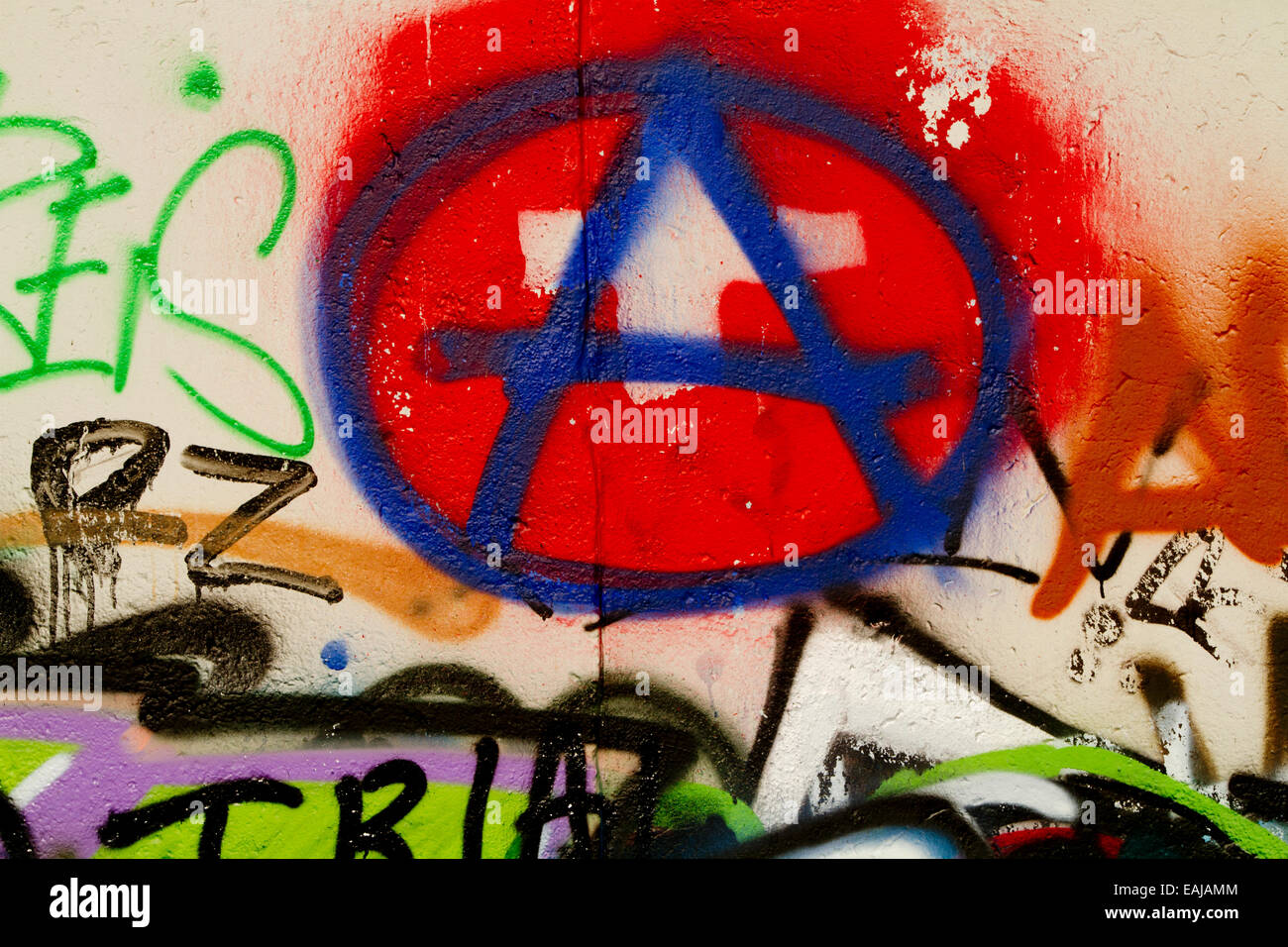 Graffiti tag art urban Berlin Wall anarchy red A Stock Photo