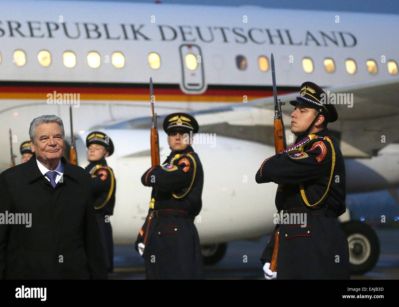 Bratislava, Slovakia. 16th Nov, 2014. German President Joachim Gauck (L) is welcomed with military honours at the airport in Bratislava, Slovakia, 16 November 2014. Gauck participates at the meeting of the presidents of the Visegrád states and of Germany on occasion of the commemoration '25 Jahre Friedliche Revolution' (lit. '25 years of peaceful revolution'). Photo: Wolfgang Kumm/dpa/Alamy Live News Stock Photo