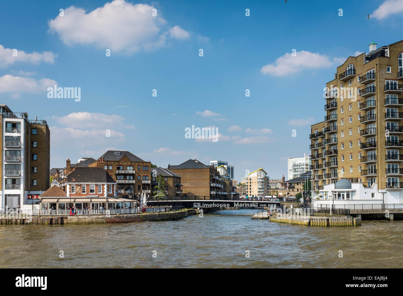 Mixed architecture of Limehouse Marina on the north bank of the River Thames, viewed from a passing boat. Stock Photo