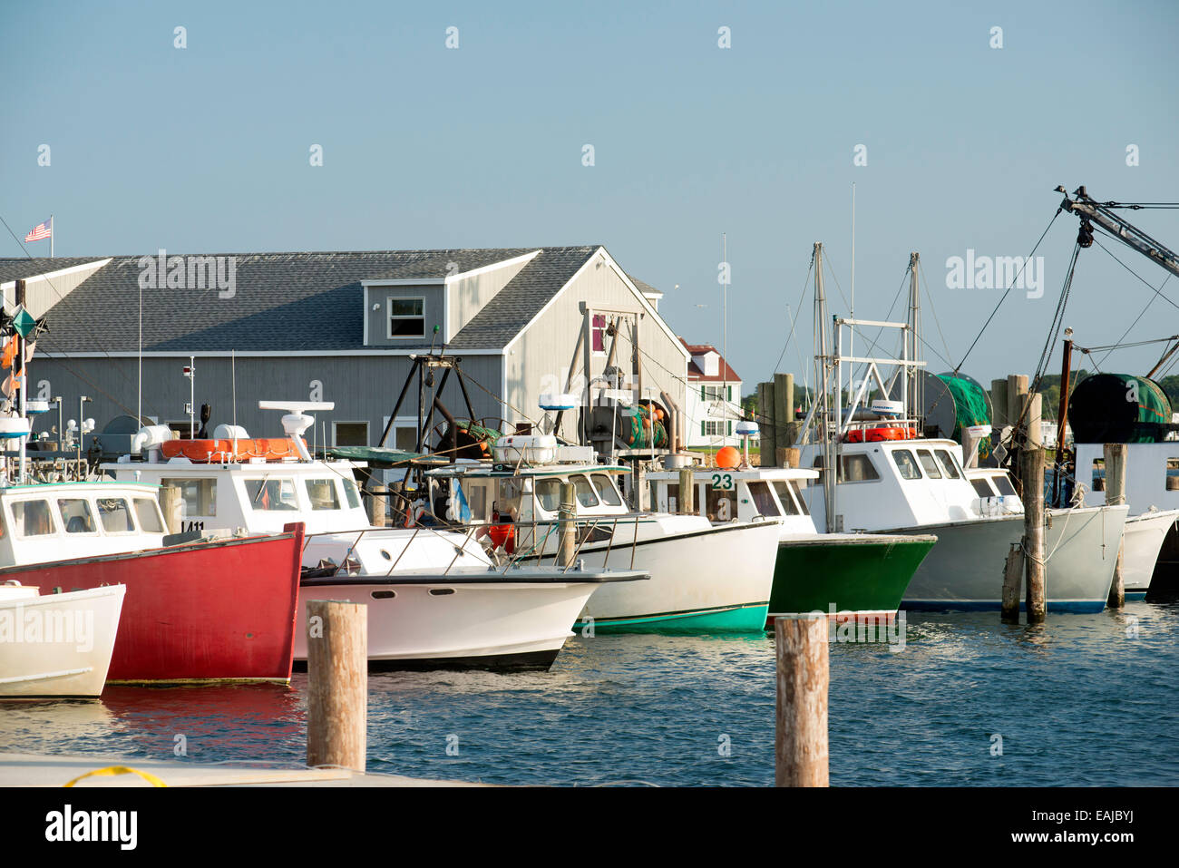 fleet colorful fishing boats in bay harbor marina Montauk New York USA