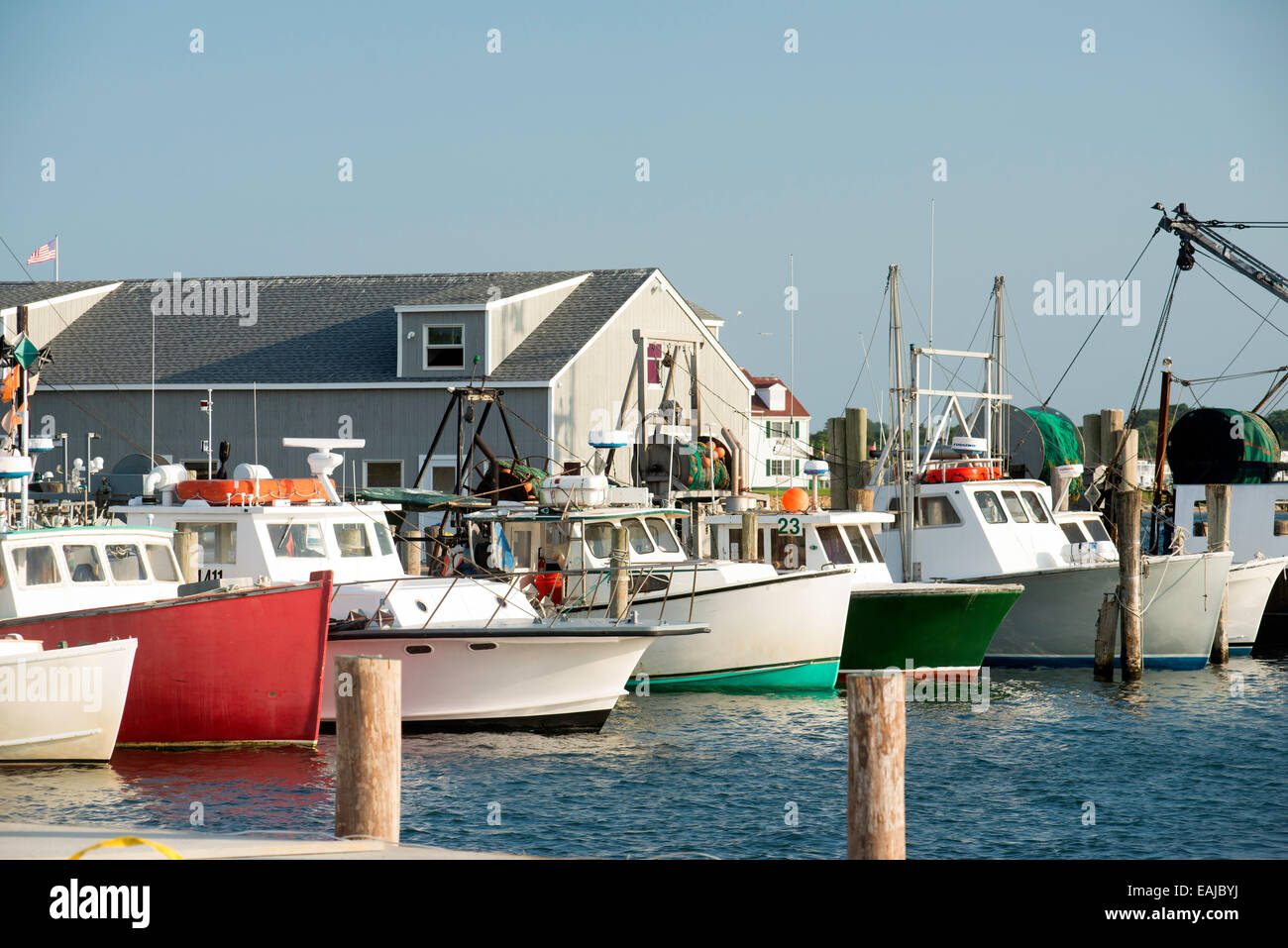 fleet colorful fishing boats in bay harbor marina Montauk New York USA Atlantic Ocean in the Hamptons Stock Photo