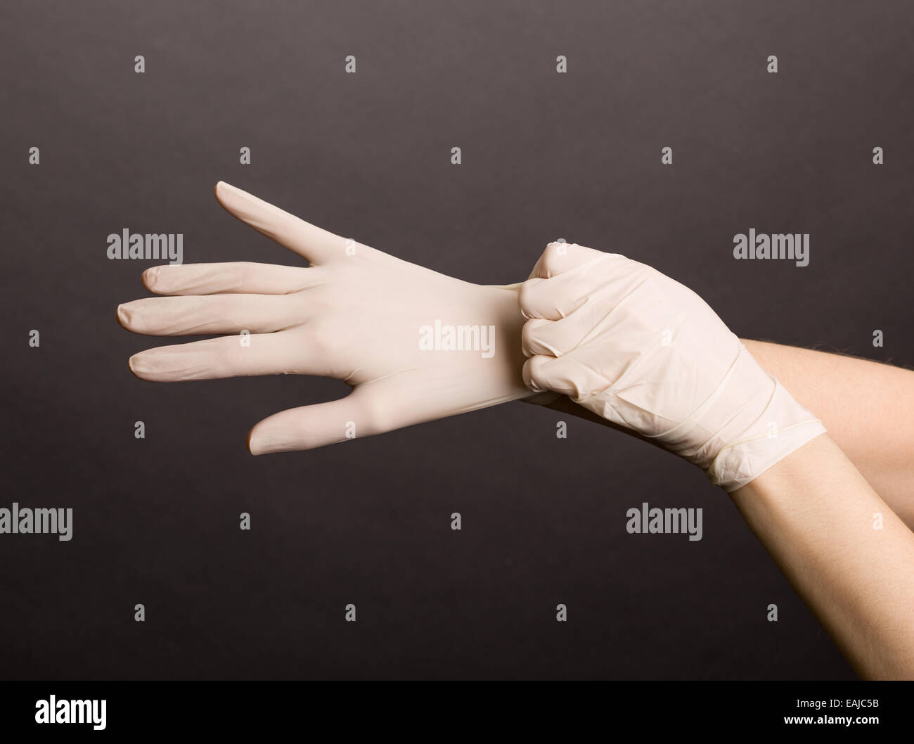 Putting on latex gloves Stock Photo Alamy