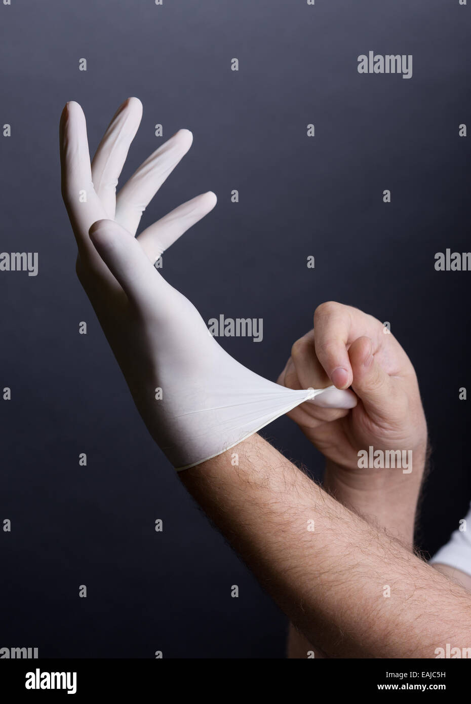 Putting on latex gloves Stock Photo Alamy