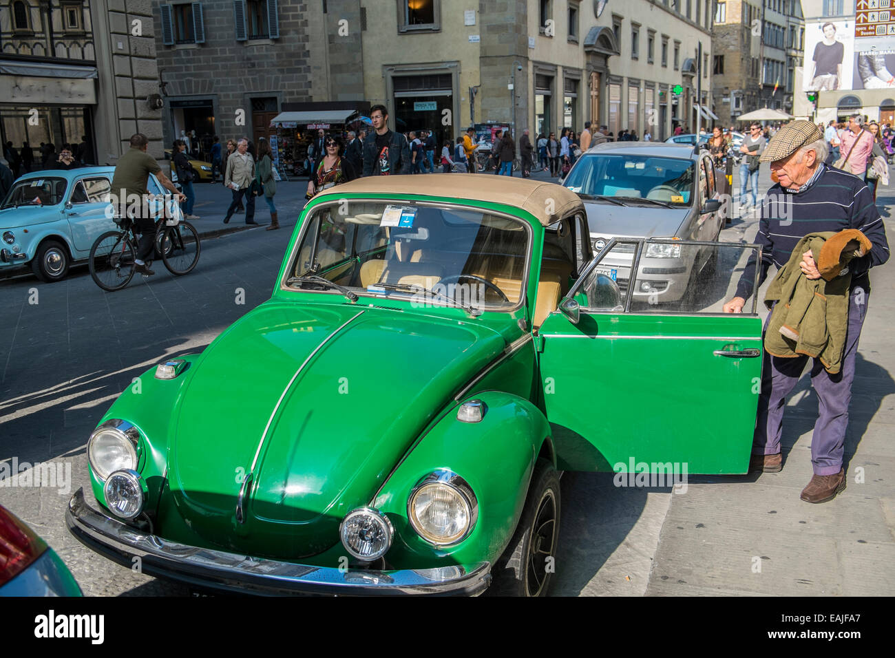 VW beetle cabriolet green parked in a street in Florence Stock Photo