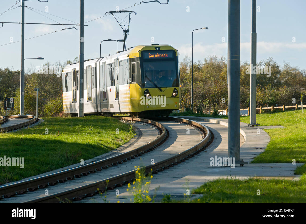 Metrolink tram near the Sale Water Park stop, Manchester, England, UK