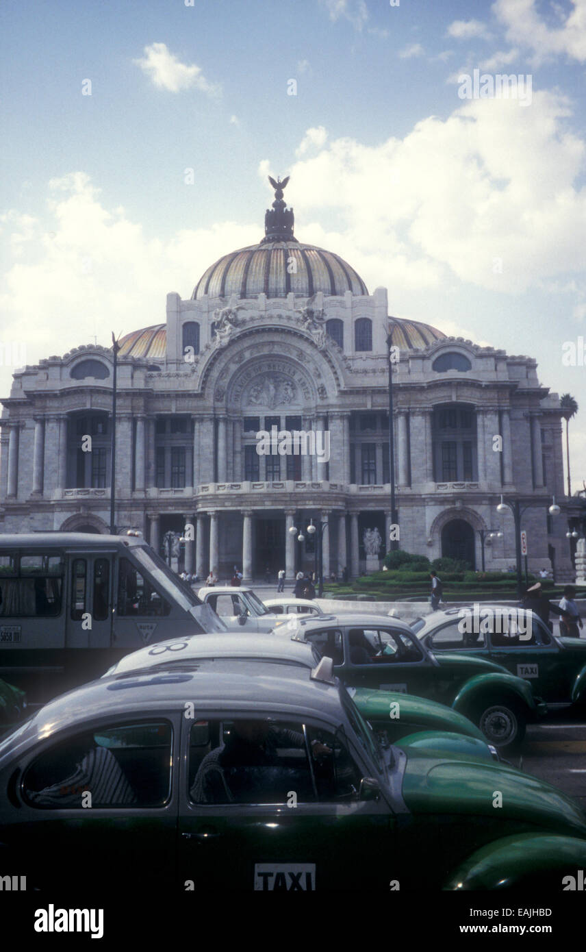 Green and white Volkswagen Bug (VW Beetle) taxis or vochos in front of the Palacio de Bellas Artes in Mexico City, Mexico Stock Photo