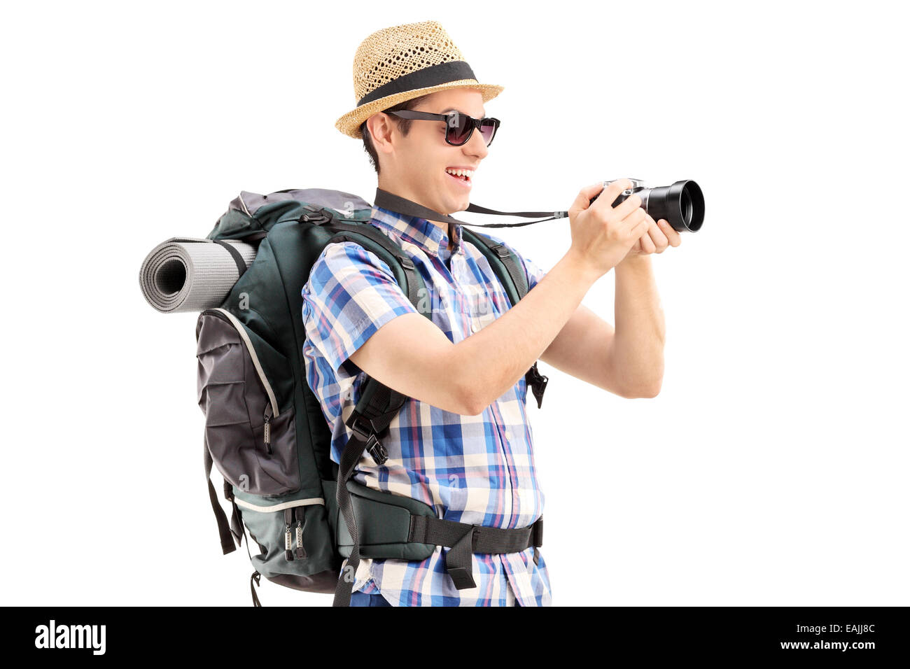 Male tourist taking a picture with a camera isolated on white background Stock Photo