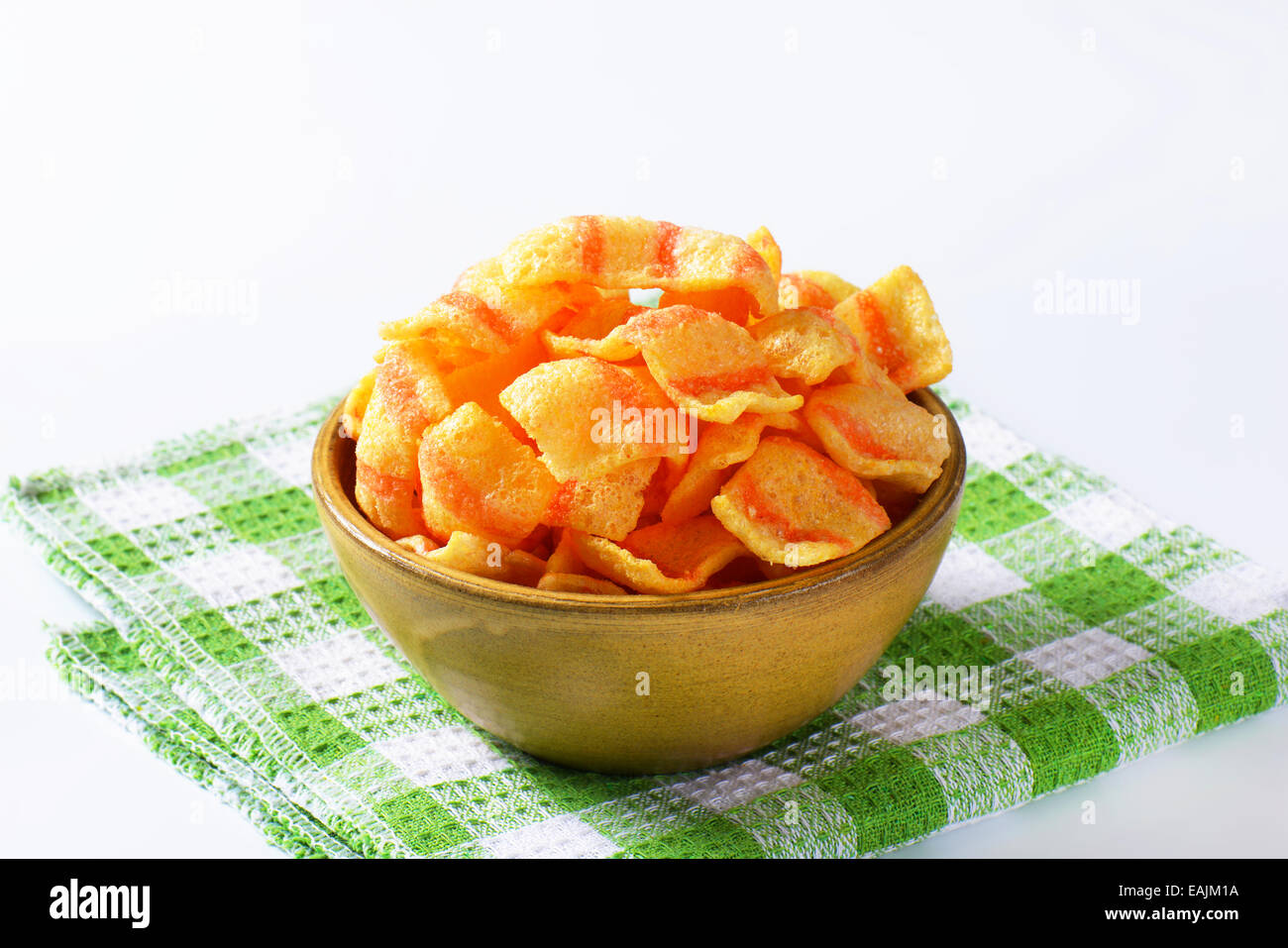 Bowl of bacon-flavored puffed wheat chips Stock Photo