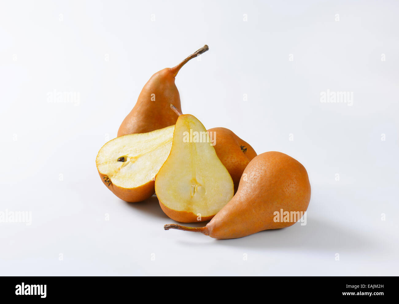 European pears, whole and cut in halves Stock Photo