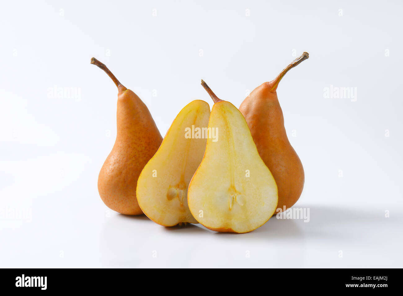 European pears, whole and cut in halves Stock Photo