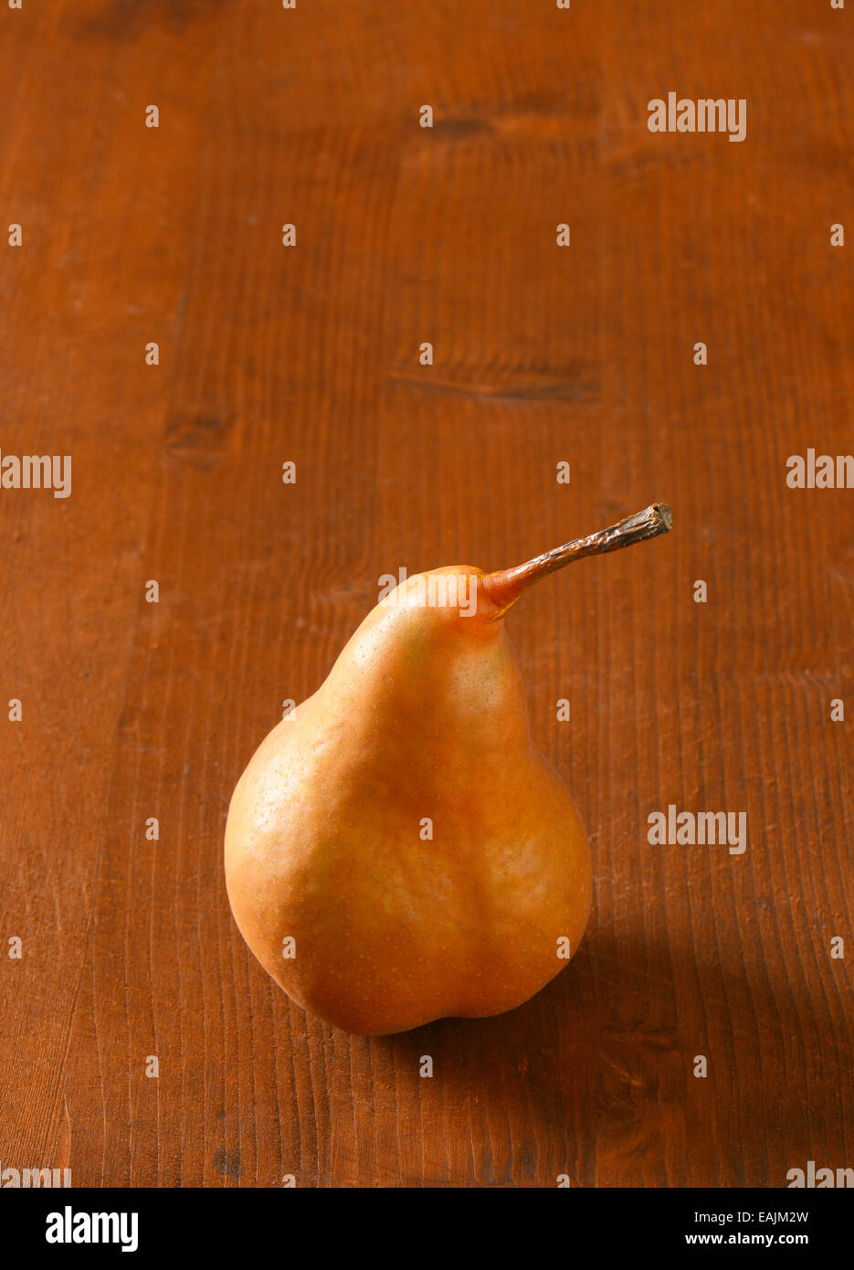 European pear with elongated slender neck and russeted skin Stock Photo