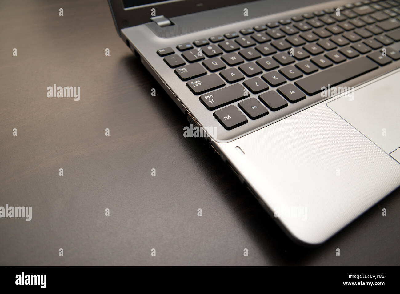 Open laptop computer close up on a wooden table Stock Photo