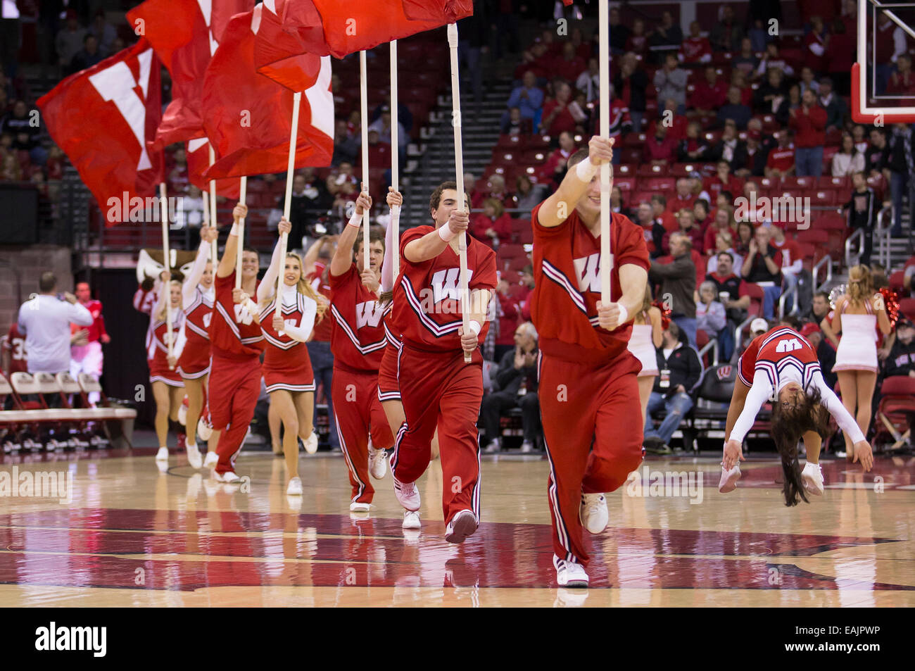 November 16, 2014: Wisconsin Cheerleaders run onto the court at the start of the NCAA Basketball game between the Wisconsin Badgers and the Chattanooga Mocs at the Kohl Center in Madison, WI. Wisconsin defeated Chattanooga 89-45. John Fisher/CSM Stock Photo