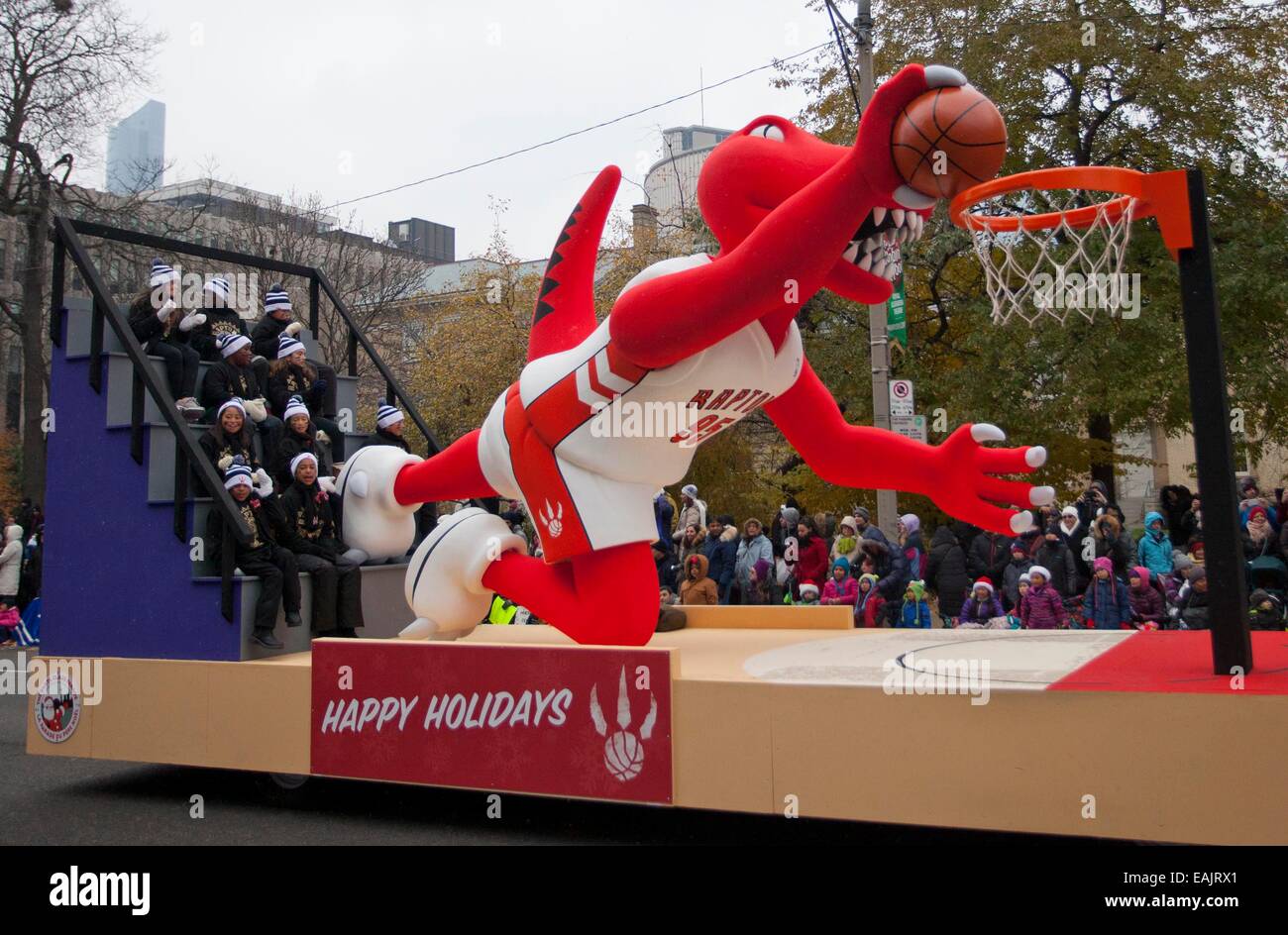 (141117) -- TORONTO, Nov. 17, 2014 (Xinhua)-- A float of Toronto Raptors' mascot is on display during the 110th Annual Toronto Santa Claus Parade in Toronto, Canada, Nov. 16, 2014. With 21 bands, 31 floats and more than 3,000 volunteers, the Parade kicked off at Toronto on Sunday. (Xinhua/Zou Zheng) Stock Photo