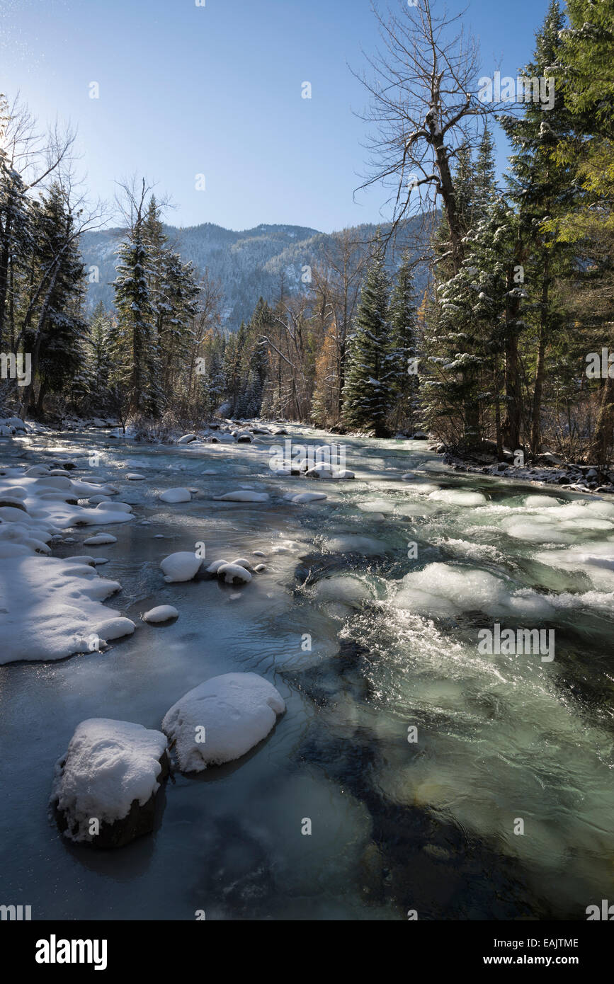 Partially frozen Lostine River in Oregon's Wallowa Mountains Stock