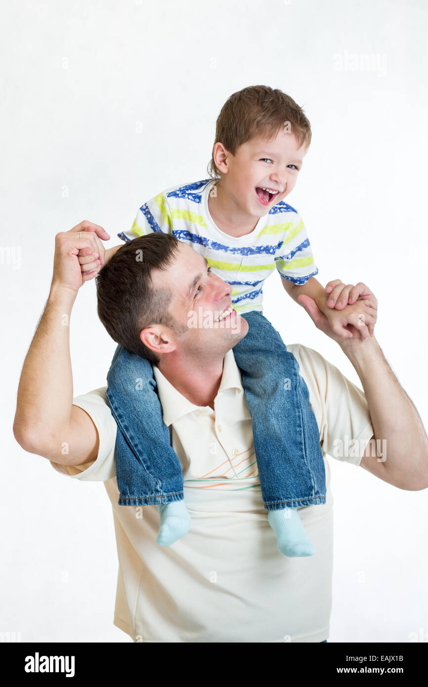 kid riding father's shoulders Stock Photo - Alamy