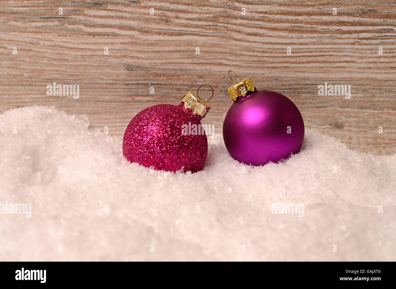 Silver christmas baubles in the snow hi-res stock photography and ...