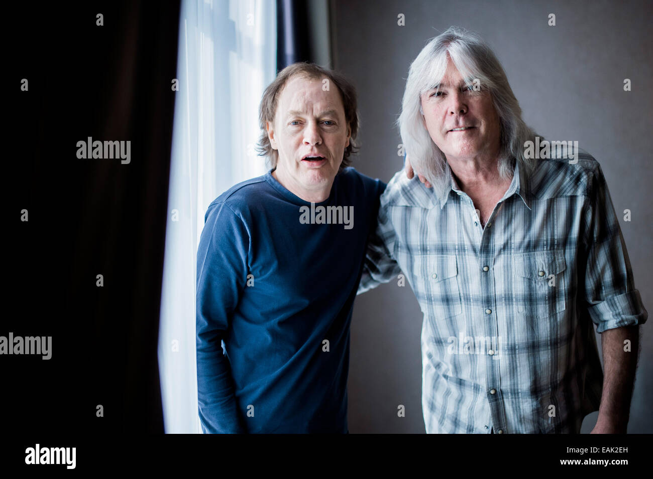 Musicians Cliff Williams (R) and Angus Young of Australian band AC/DC pose for photos during an interview in Duesseldorf, Germany, 06 November 2014. The band will release their now album on 28 November 2014. Photo: Marcus Simaitis/dpa Stock Photo